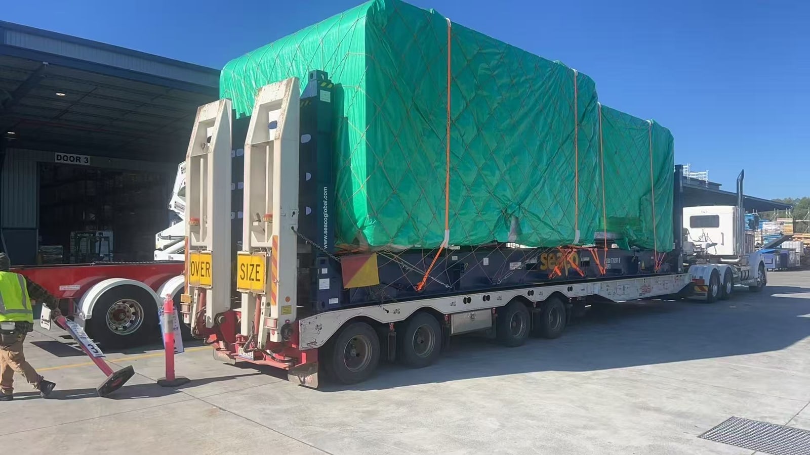 Portable buildings on a low-loader